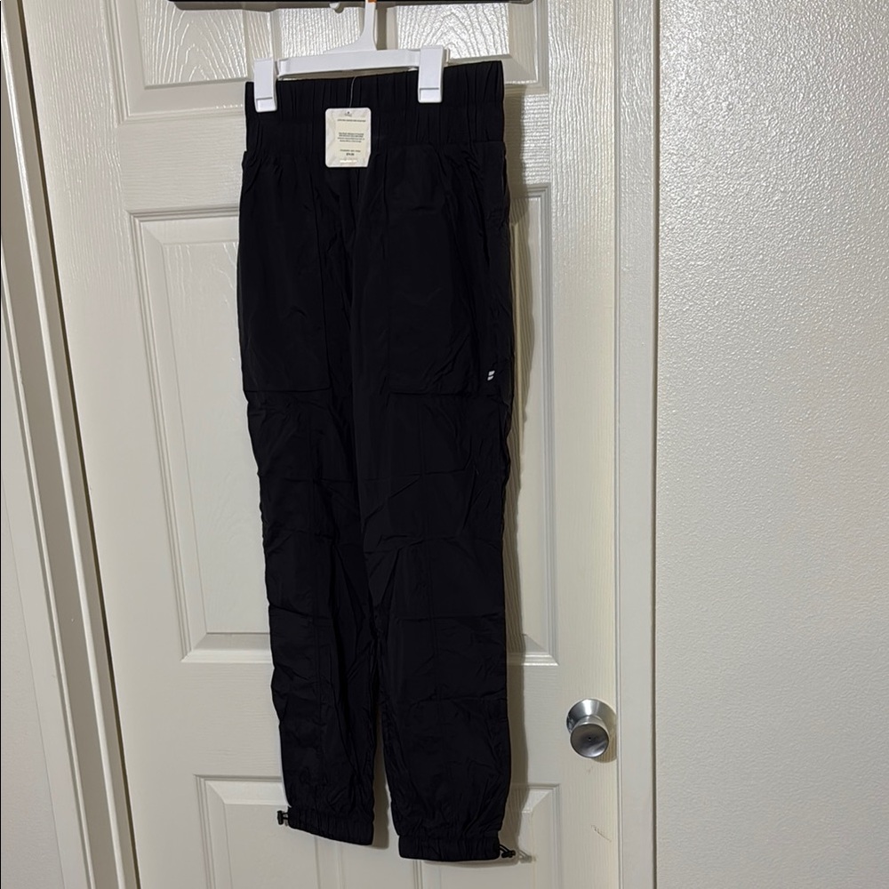 Ultra high waisted, piped nylon pants